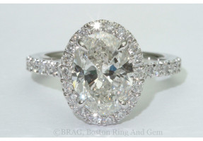 Oval brilliant cut diamond set in a fishtail set Oval halo on a cathedral band
