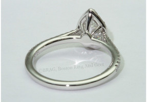 Pear shaped diamond set in a fishtail set pear halo on a cathedral band