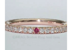 18k rose gold and diamond with 1 ruby fishtail set Birth stone eternity band.