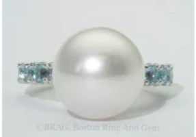 Pearl and blue topaz platinum ring